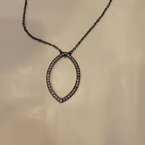 Givenchy Light Topaz colored blue stone set in dark gunmetal colored chain